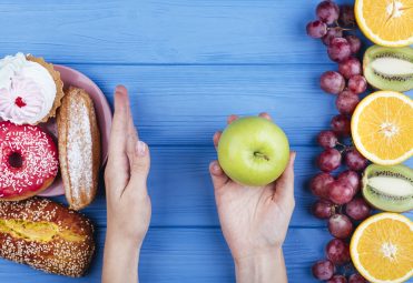 person-choosing-healthy-food-sweets